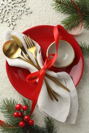 Photo of Christmas table setting with festive decor, flat lay