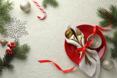 Photo of Christmas table setting with festive decor, flat lay