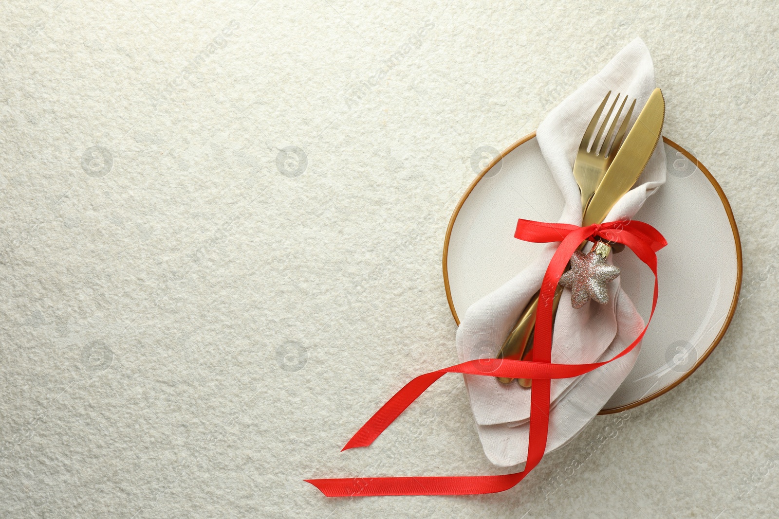 Photo of Christmas table setting with festive decor, top view. Space for text