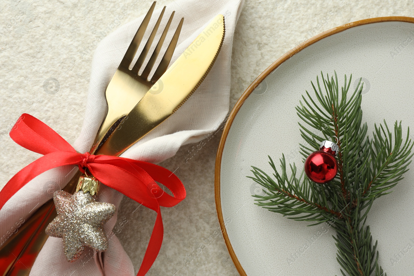 Photo of Christmas table setting with festive decor, flat lay