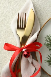 Photo of Christmas table setting with festive decor, flat lay