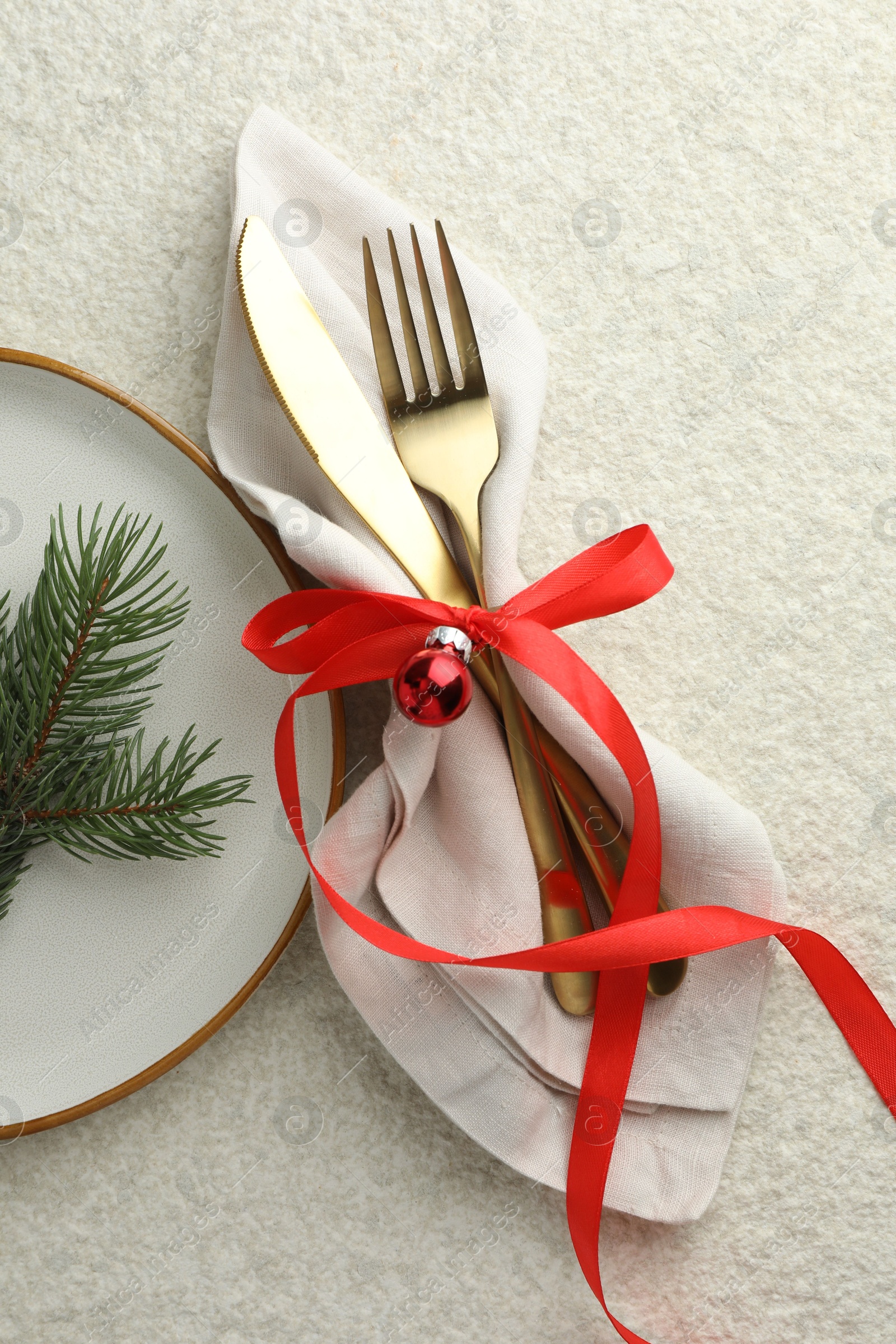 Photo of Christmas table setting with festive decor, flat lay