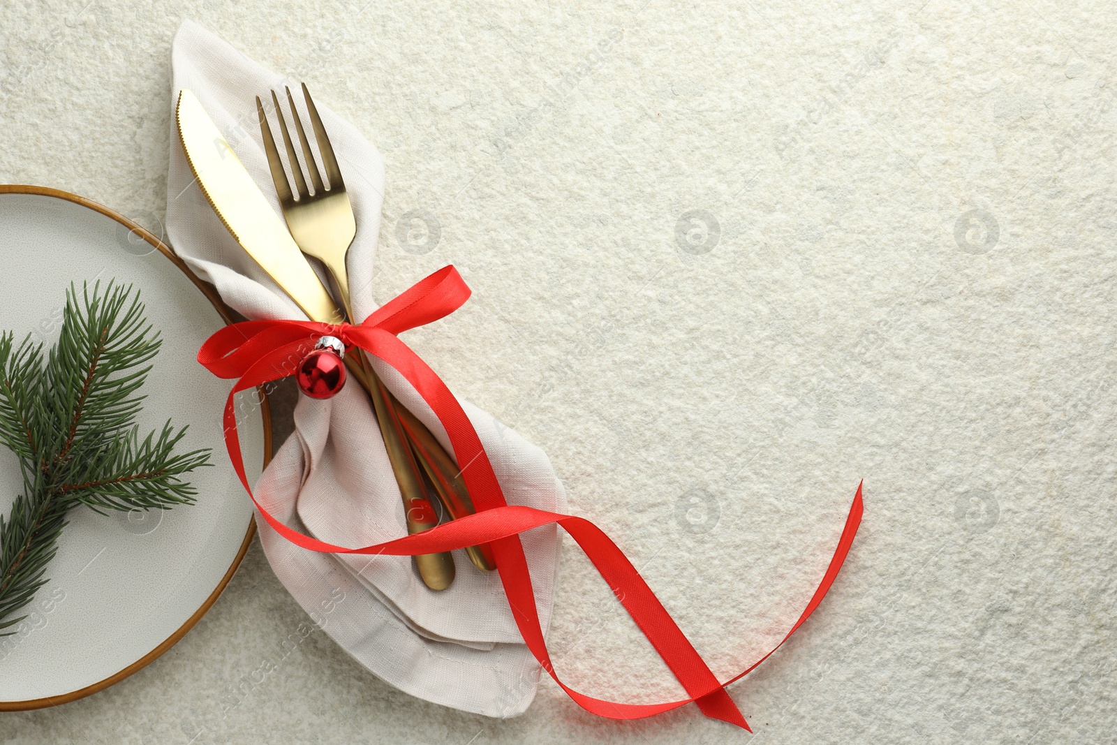 Photo of Christmas table setting with festive decor, flat lay. Space for text