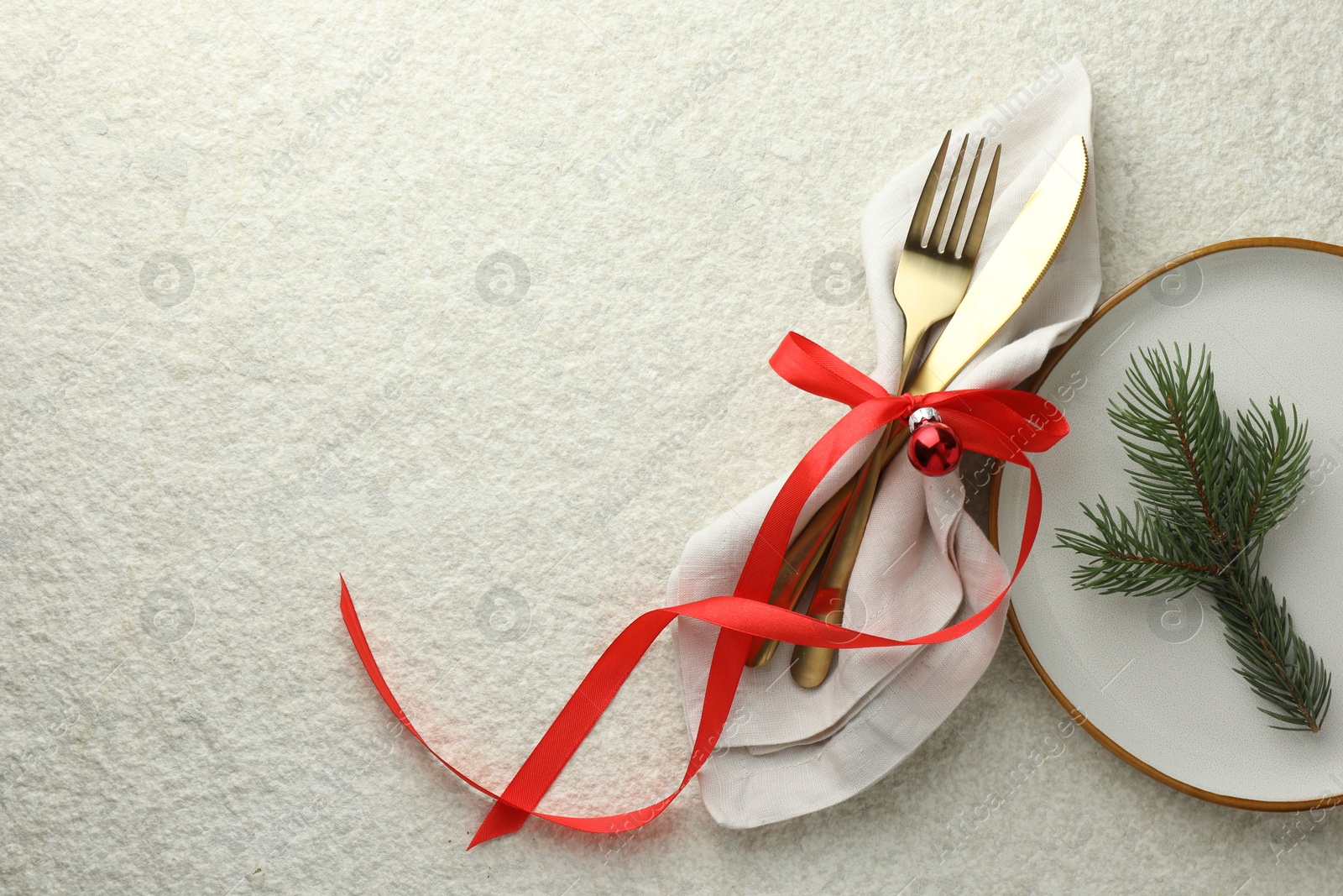 Photo of Christmas table setting with festive decor, flat lay. Space for text