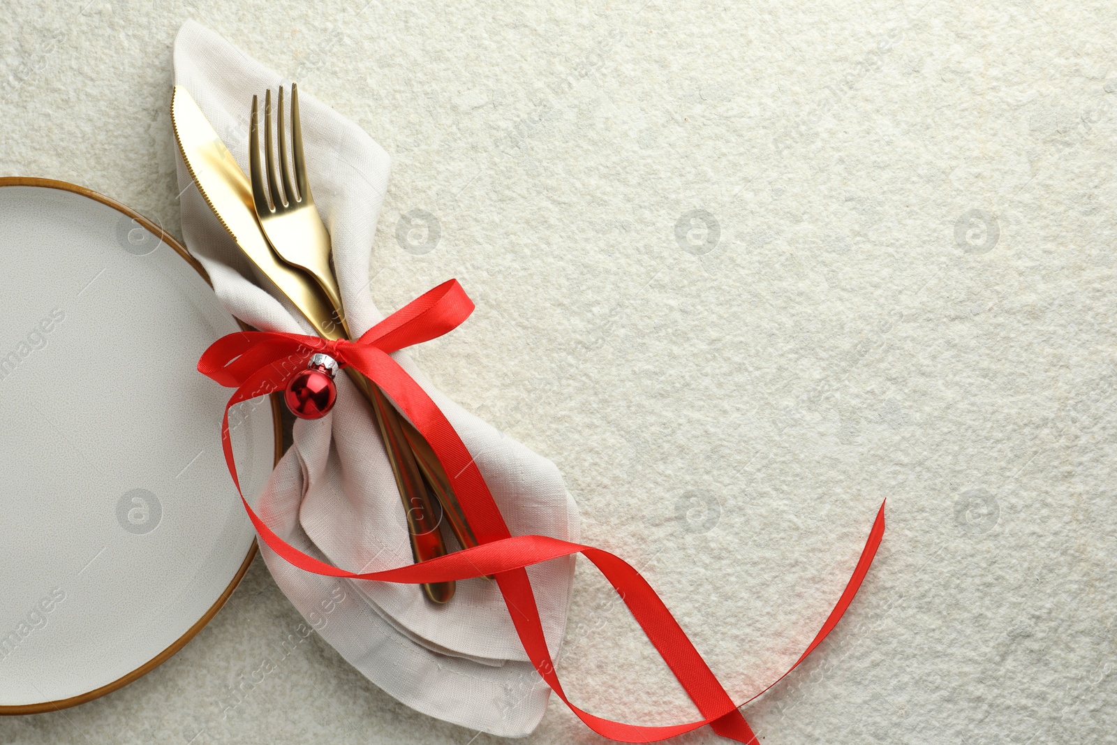 Photo of Christmas table setting with festive decor, flat lay. Space for text