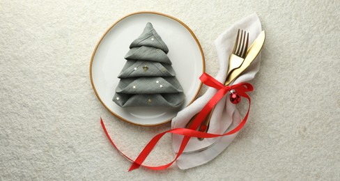 Photo of Christmas table setting with festive decor, flat lay