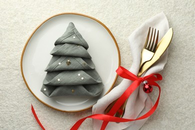 Photo of Christmas table setting with festive decor, flat lay