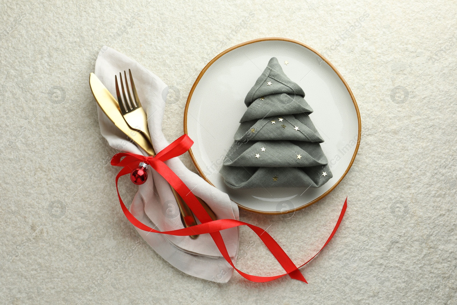 Photo of Christmas table setting with festive decor, flat lay