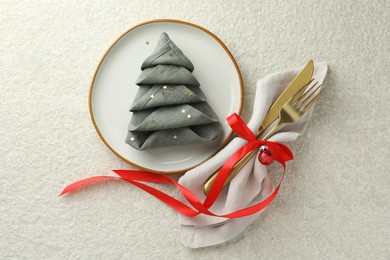 Photo of Christmas table setting with festive decor, flat lay