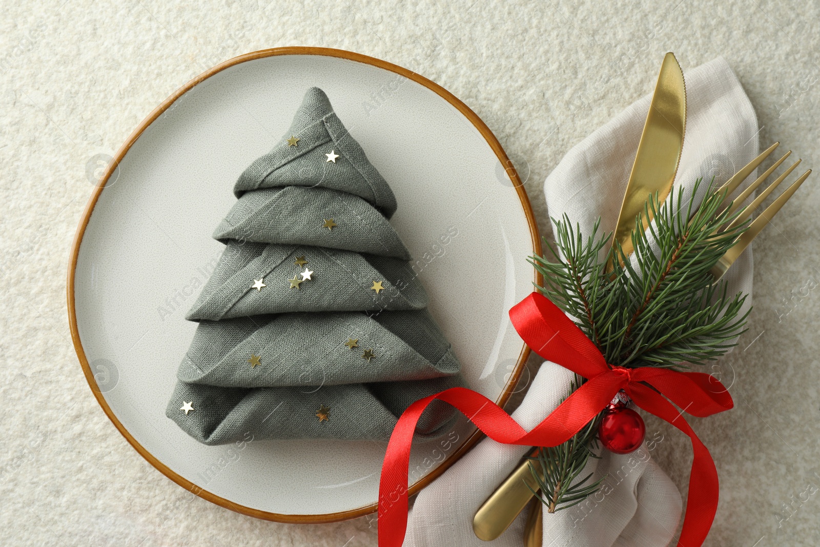 Photo of Christmas table setting with festive decor, flat lay