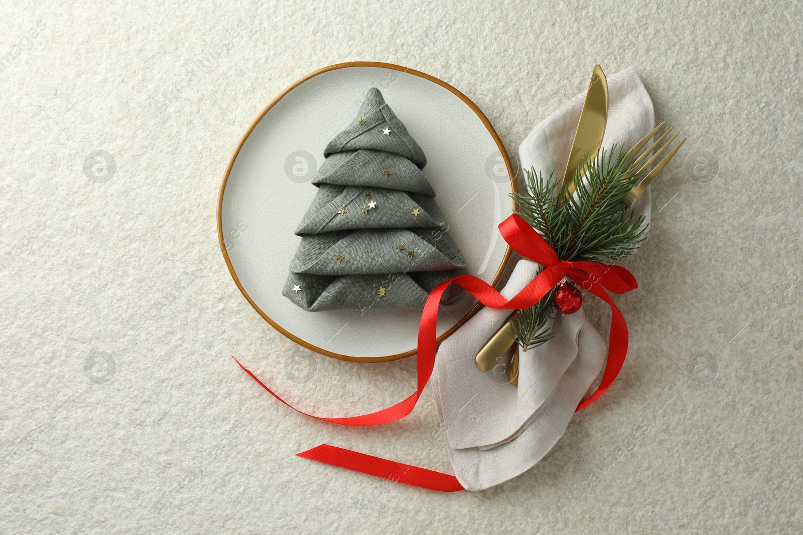 Photo of Christmas table setting with festive decor, flat lay