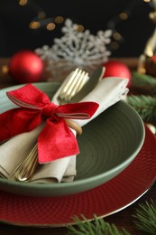 Photo of Beautiful Christmas setting on wooden table, closeup