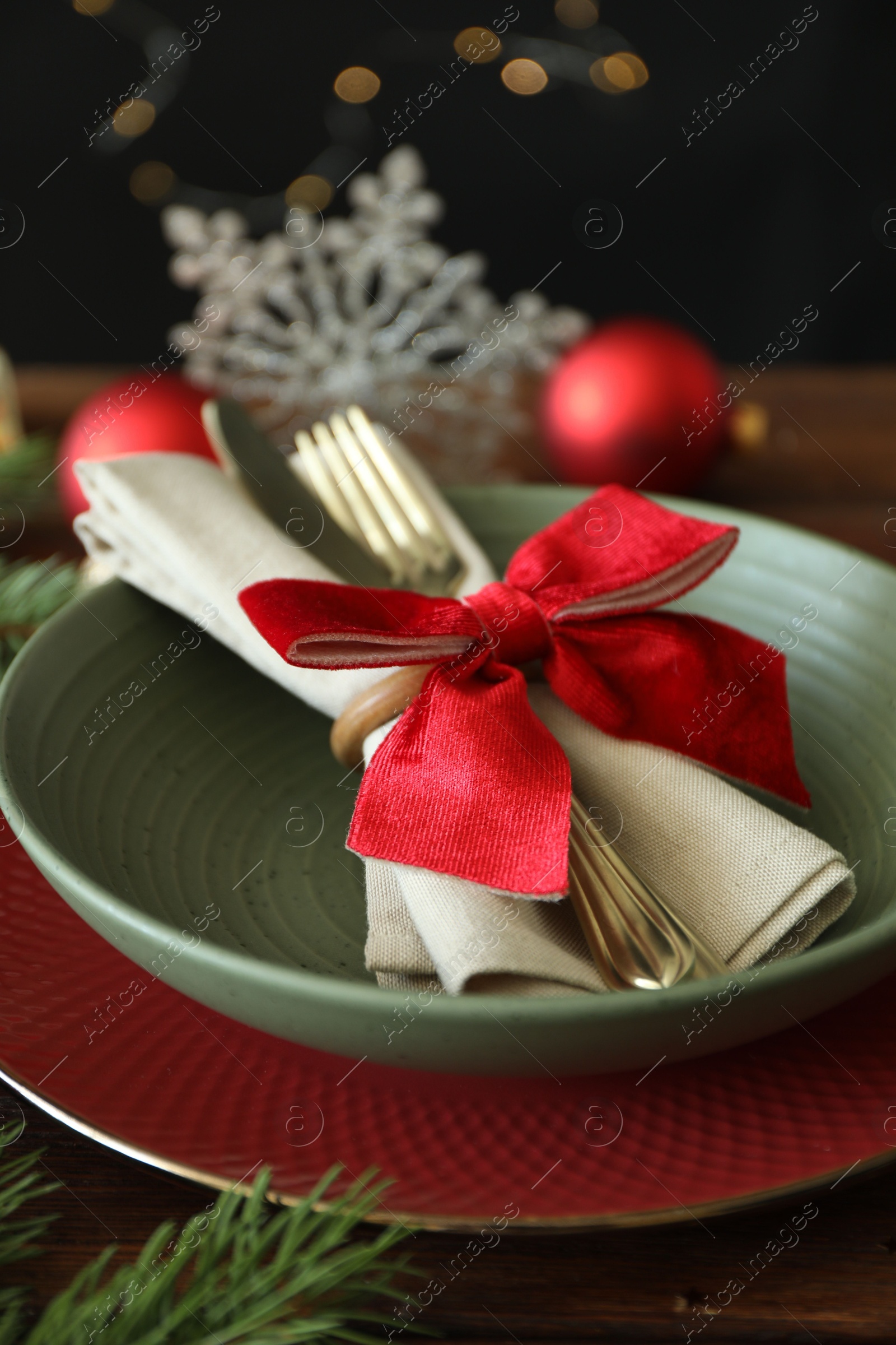 Photo of Beautiful Christmas setting on wooden table, closeup