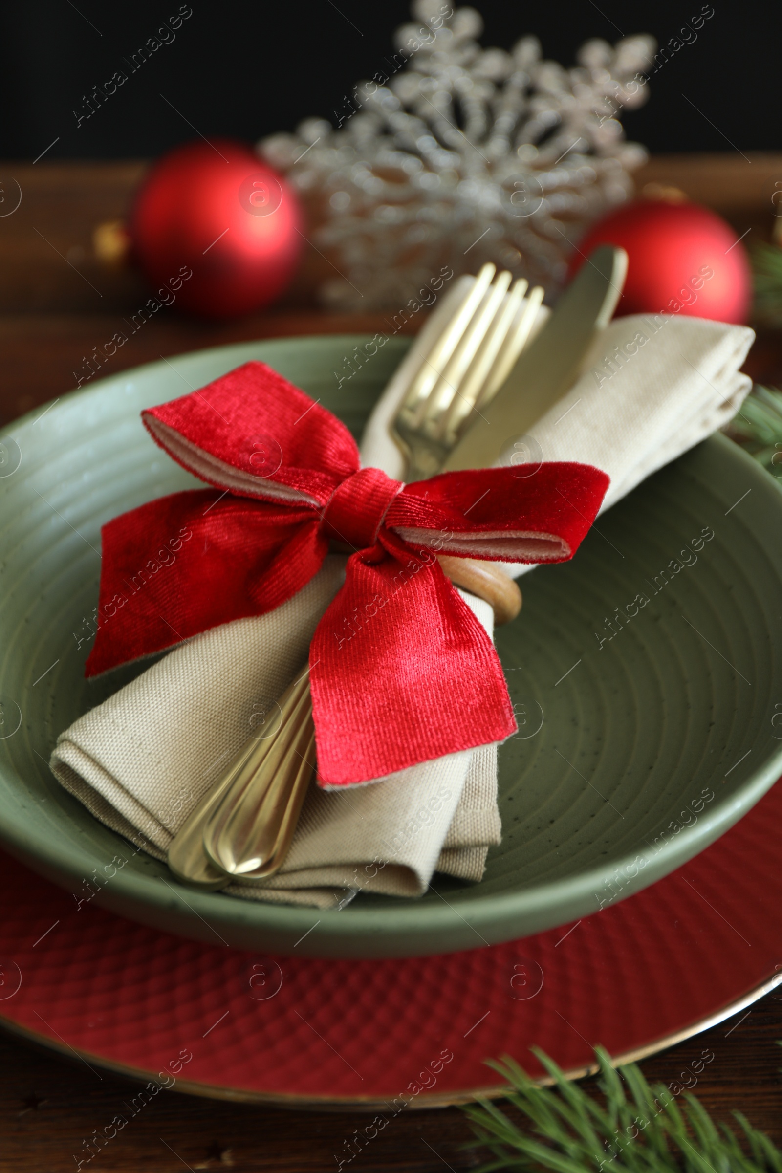 Photo of Beautiful Christmas setting on wooden table, closeup