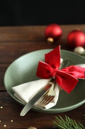 Photo of Beautiful Christmas setting on wooden table, closeup