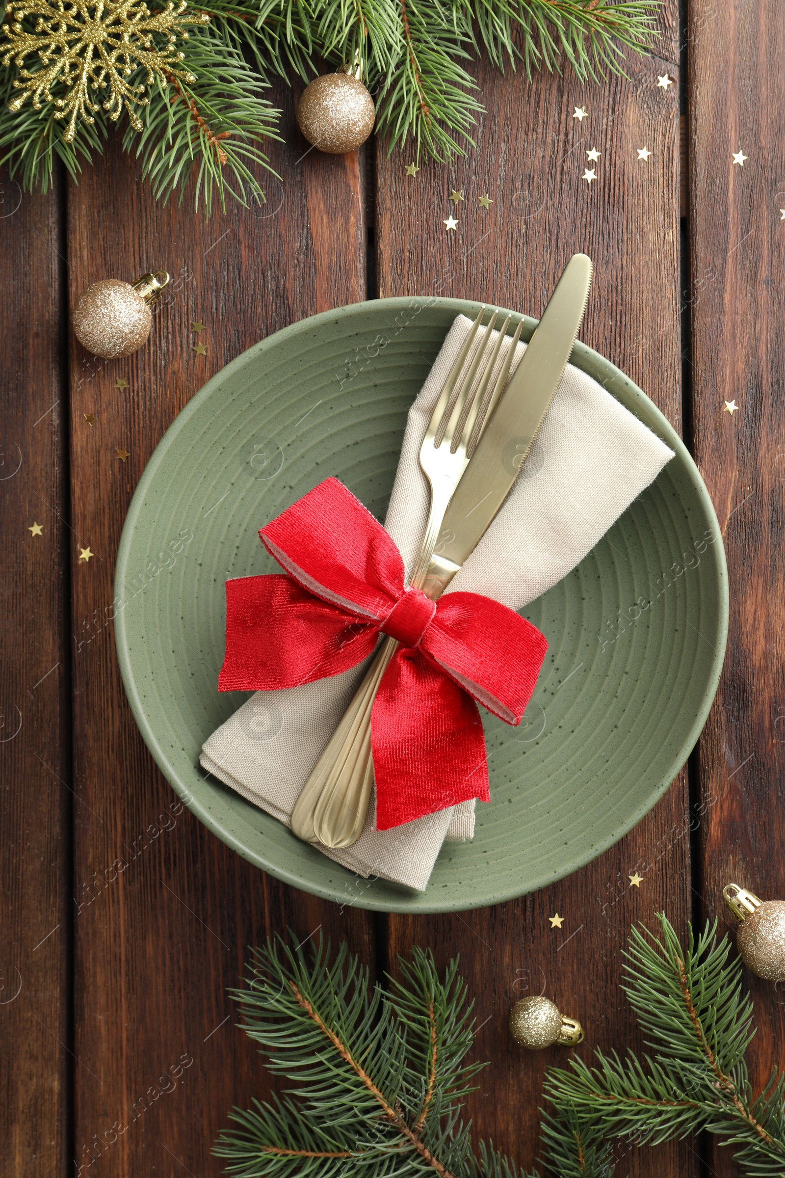 Photo of Christmas setting and festive decor on wooden table, flat lay