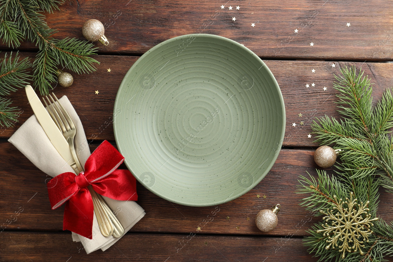 Photo of Christmas setting and festive decor on wooden table, flat lay