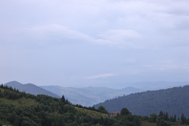 Picturesque view of beautiful mountains covered with fog