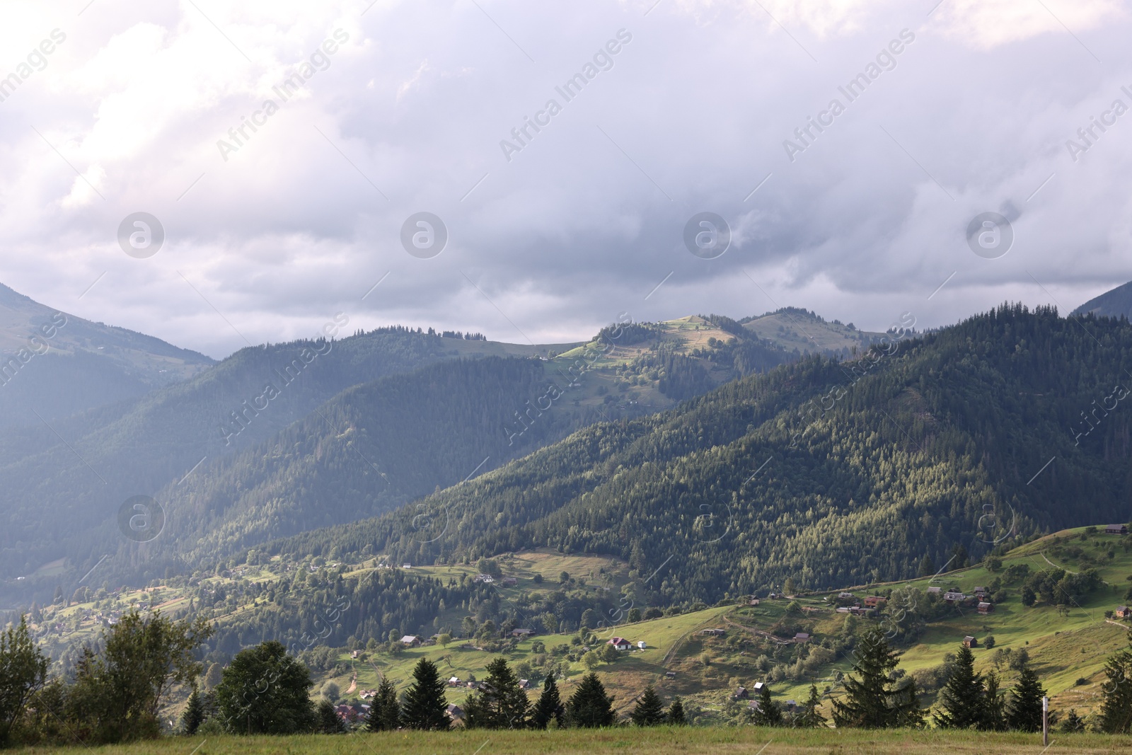 Photo of Picturesque view of beautiful mountains under cloudy sky