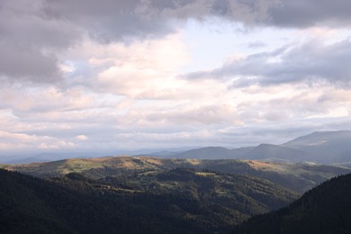 Photo of Picturesque view of beautiful mountains under cloudy sky