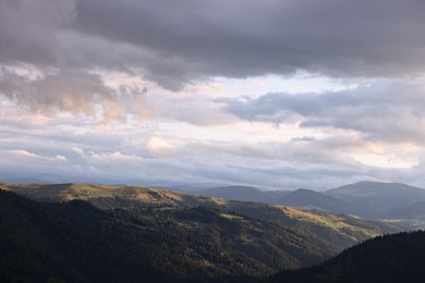 Photo of Picturesque view of beautiful mountains under cloudy sky