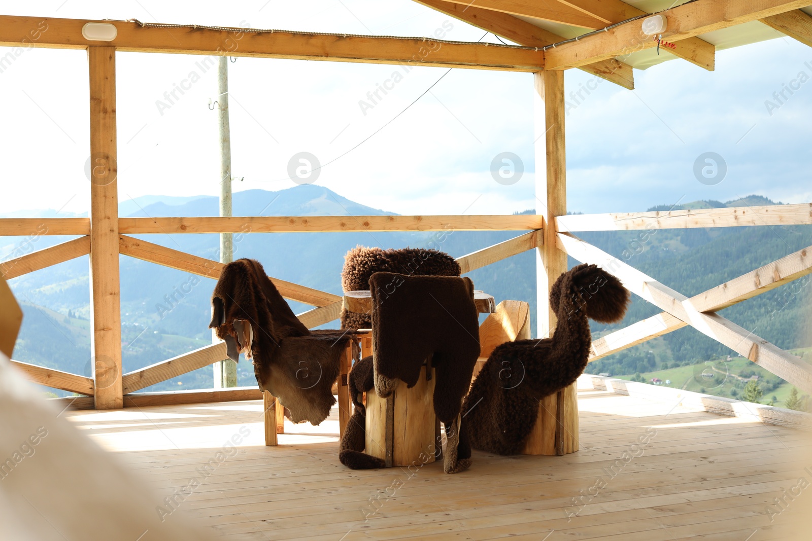 Photo of Cozy cafeteria with stylish furniture in mountains