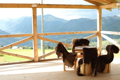 Photo of Cozy cafeteria with stylish furniture in mountains