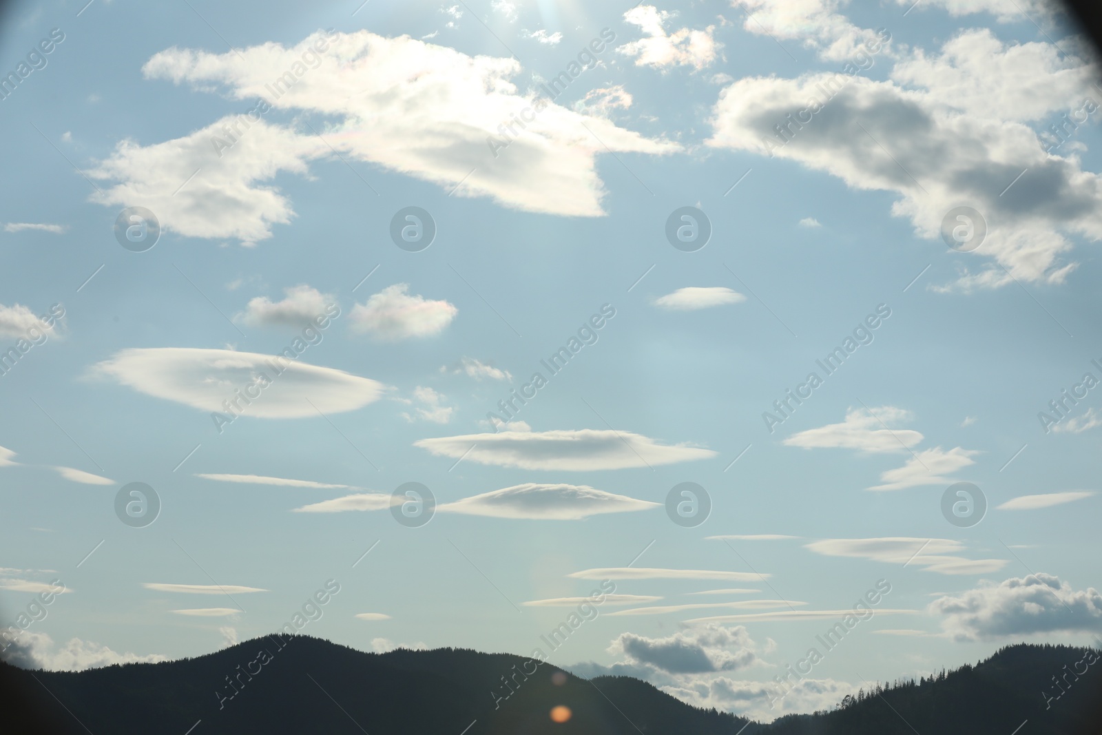 Photo of Picturesque view of mountains and beautiful clouds in sky