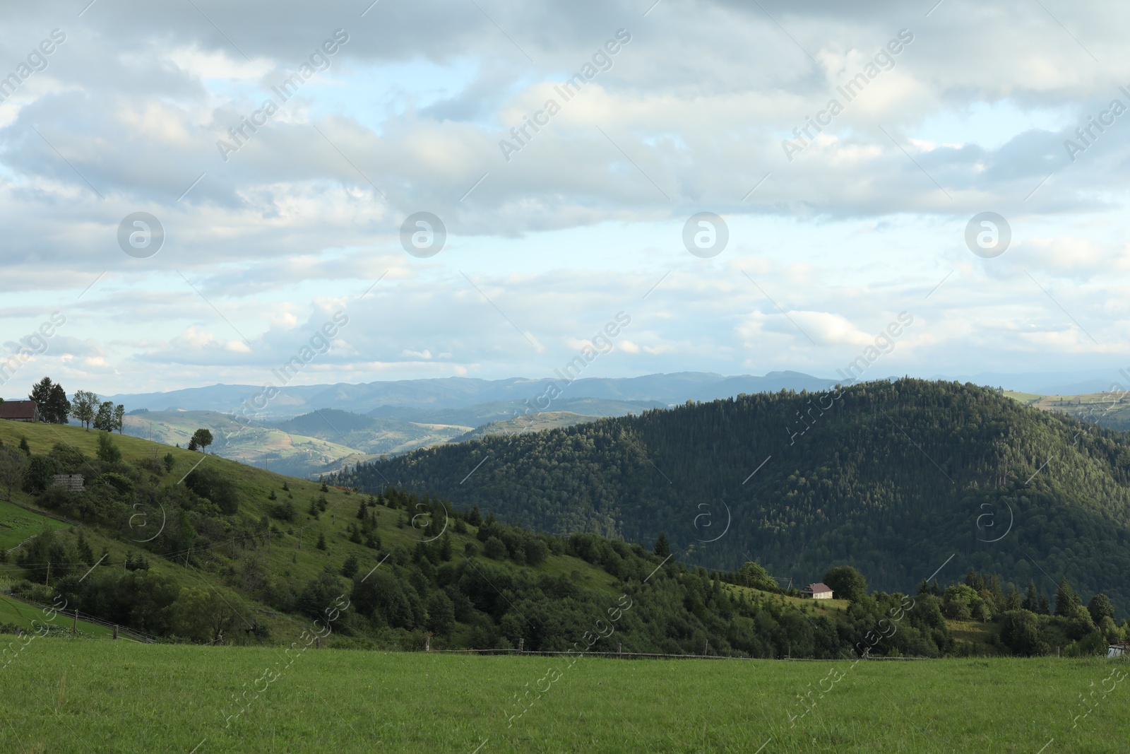 Photo of Picturesque view of beautiful mountains under cloudy sky