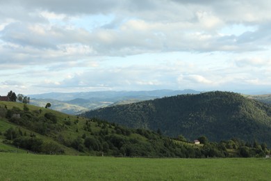 Photo of Picturesque view of beautiful mountains under cloudy sky