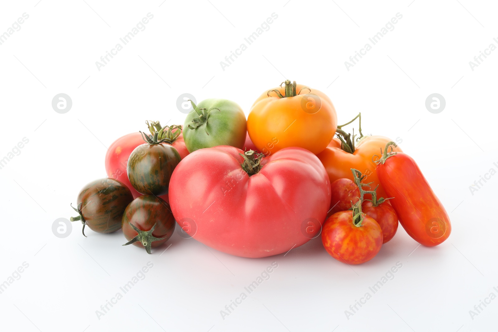 Photo of Different sorts of fresh ripe tomatoes isolated on white