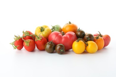 Photo of Different sorts of fresh ripe tomatoes isolated on white