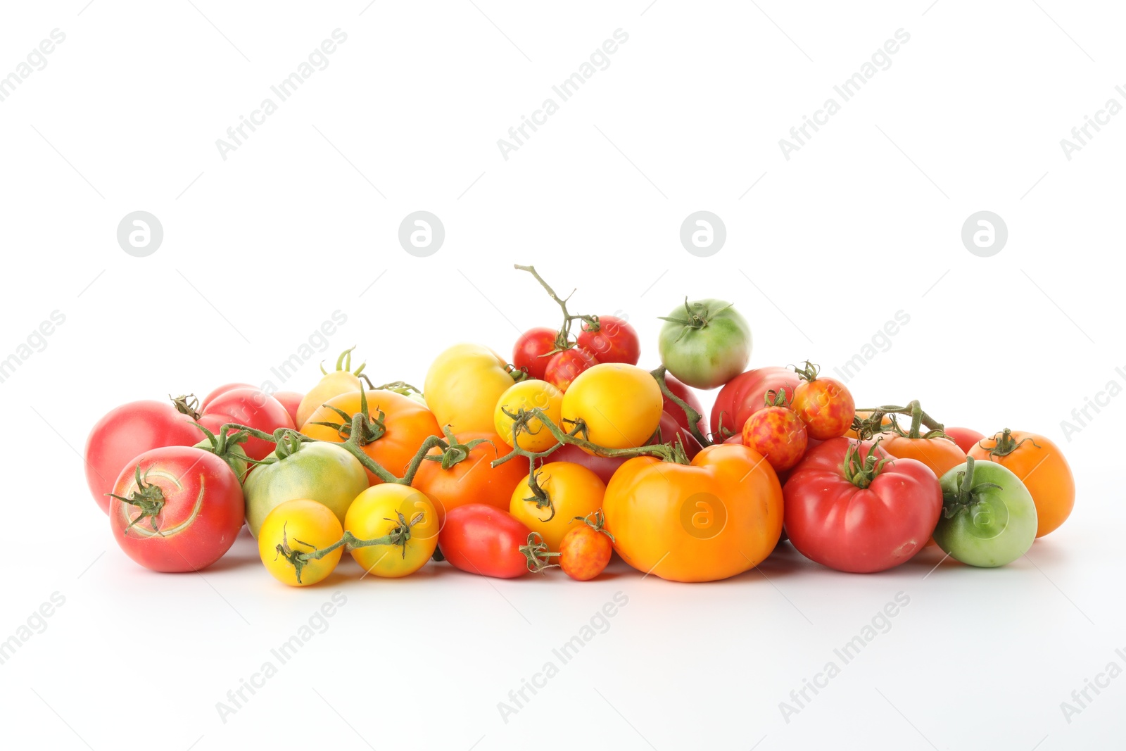 Photo of Different sorts of fresh ripe tomatoes isolated on white