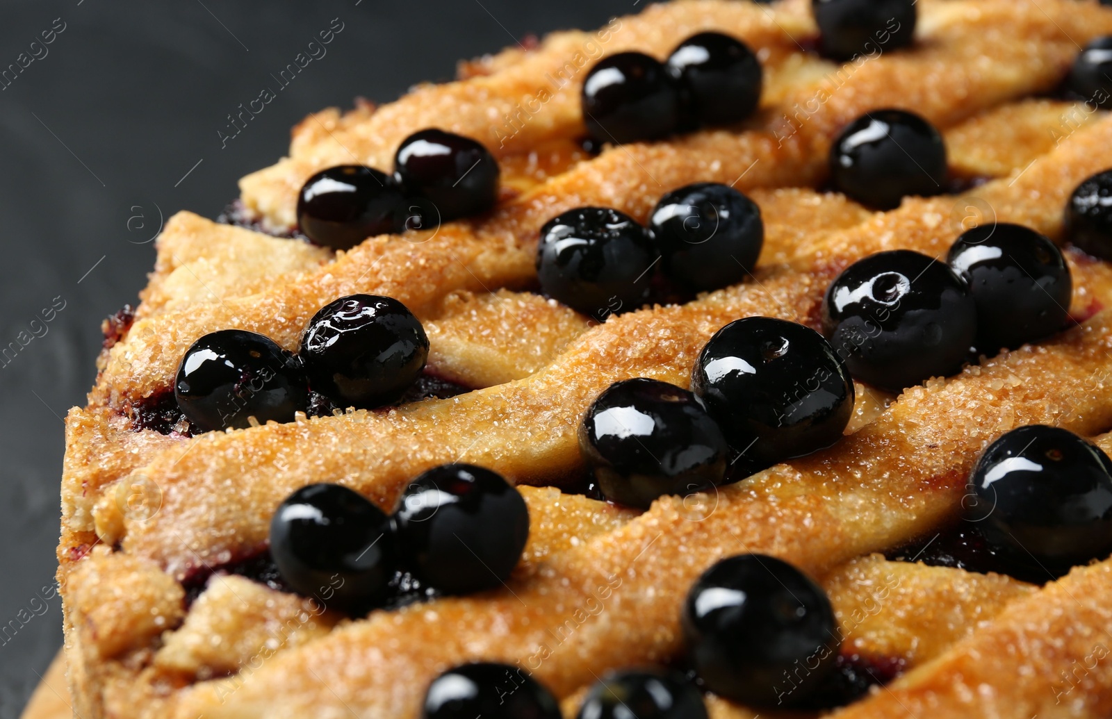 Photo of Delicious homemade blueberry pie on table, closeup