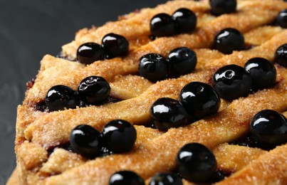 Photo of Delicious homemade blueberry pie on table, closeup