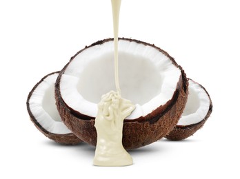 Pouring melted chocolate onto coconut against white background