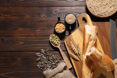 Photo of Different types of cereals, seeds and legumes on wooden table, flat lay. Space for text