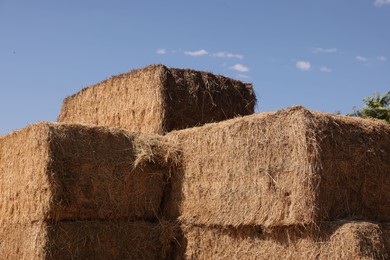 Photo of Bales of hay outdoors on sunny day, closeup