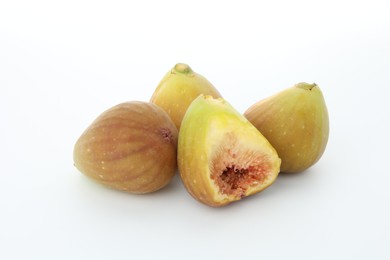 Photo of Many fresh ripe figs on white background