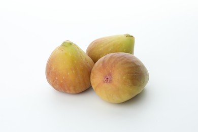 Photo of Many fresh ripe figs on white background