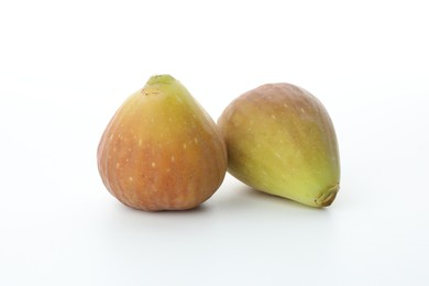 Two fresh ripe figs on white background