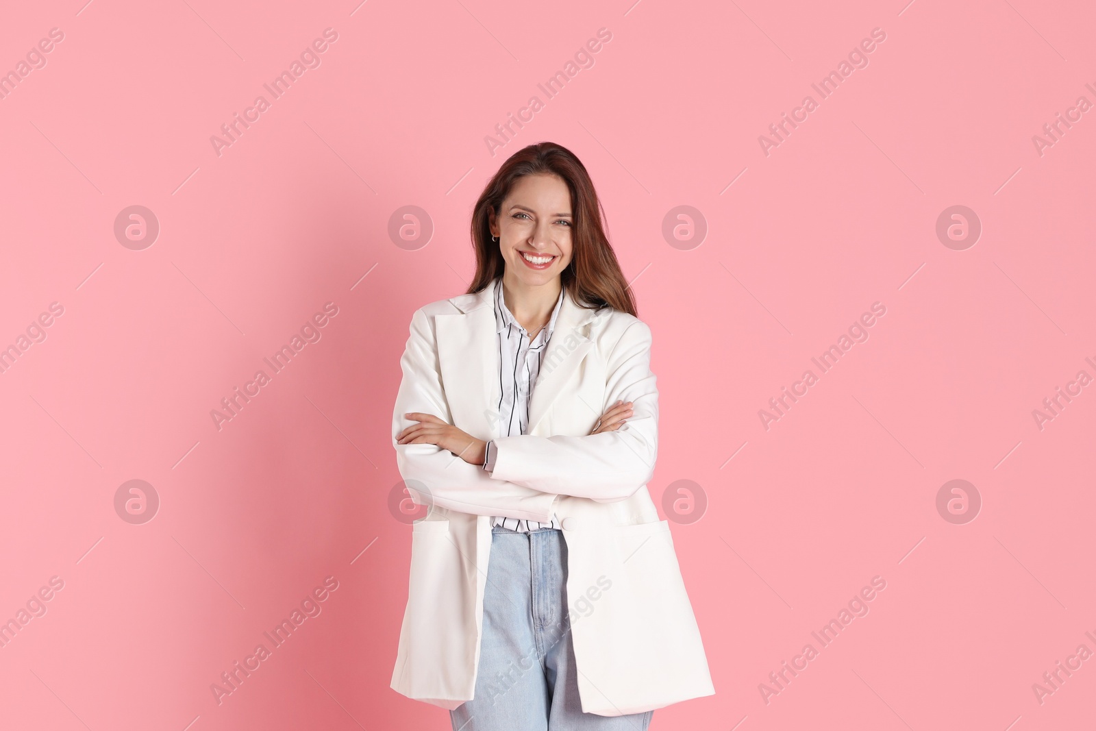 Photo of Beautiful woman in stylish white jacket on pink background