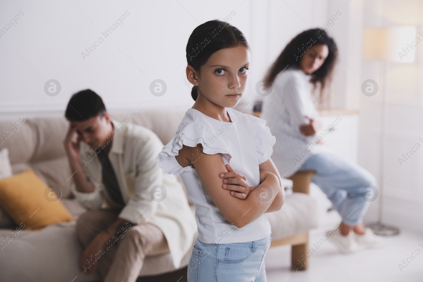 Photo of Divorce concept. Angry couple arguing at home, focus on their sad daughter