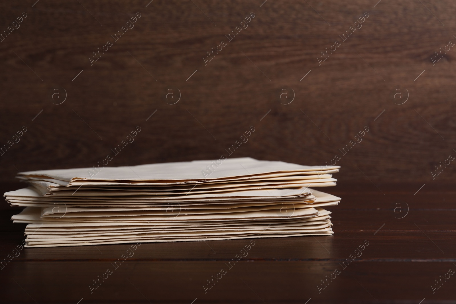 Photo of Stack of old letters on wooden table