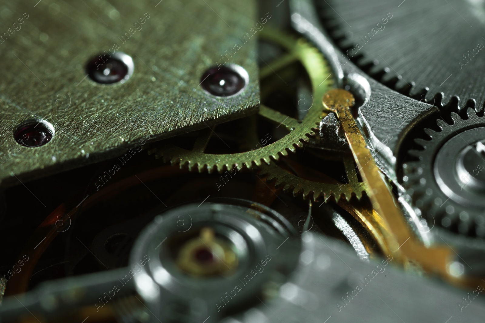 Photo of Mechanism of vintage wrist watch as background, closeup