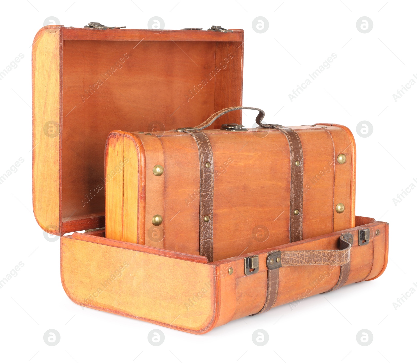 Photo of Three new wooden suitcases isolated on white