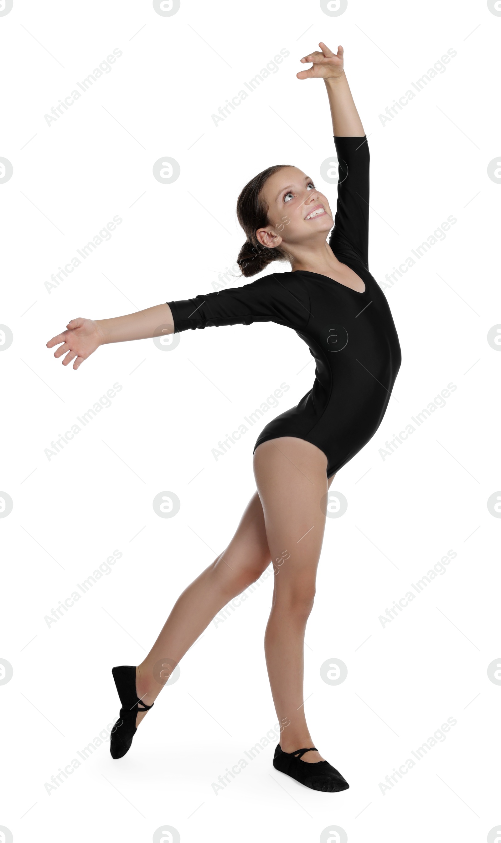 Photo of Little ballerina practicing dance moves on white background