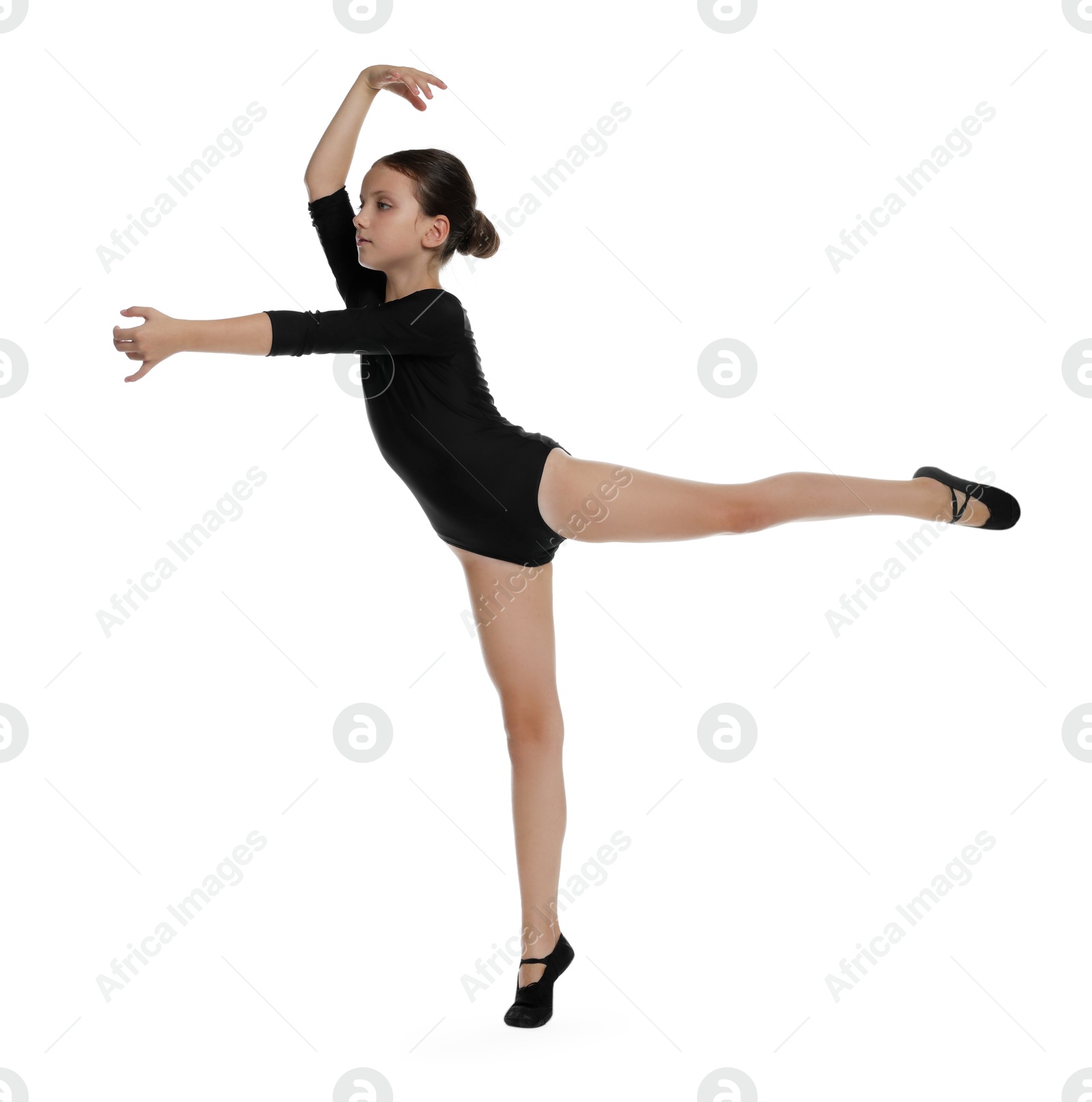 Photo of Little ballerina practicing dance moves on white background