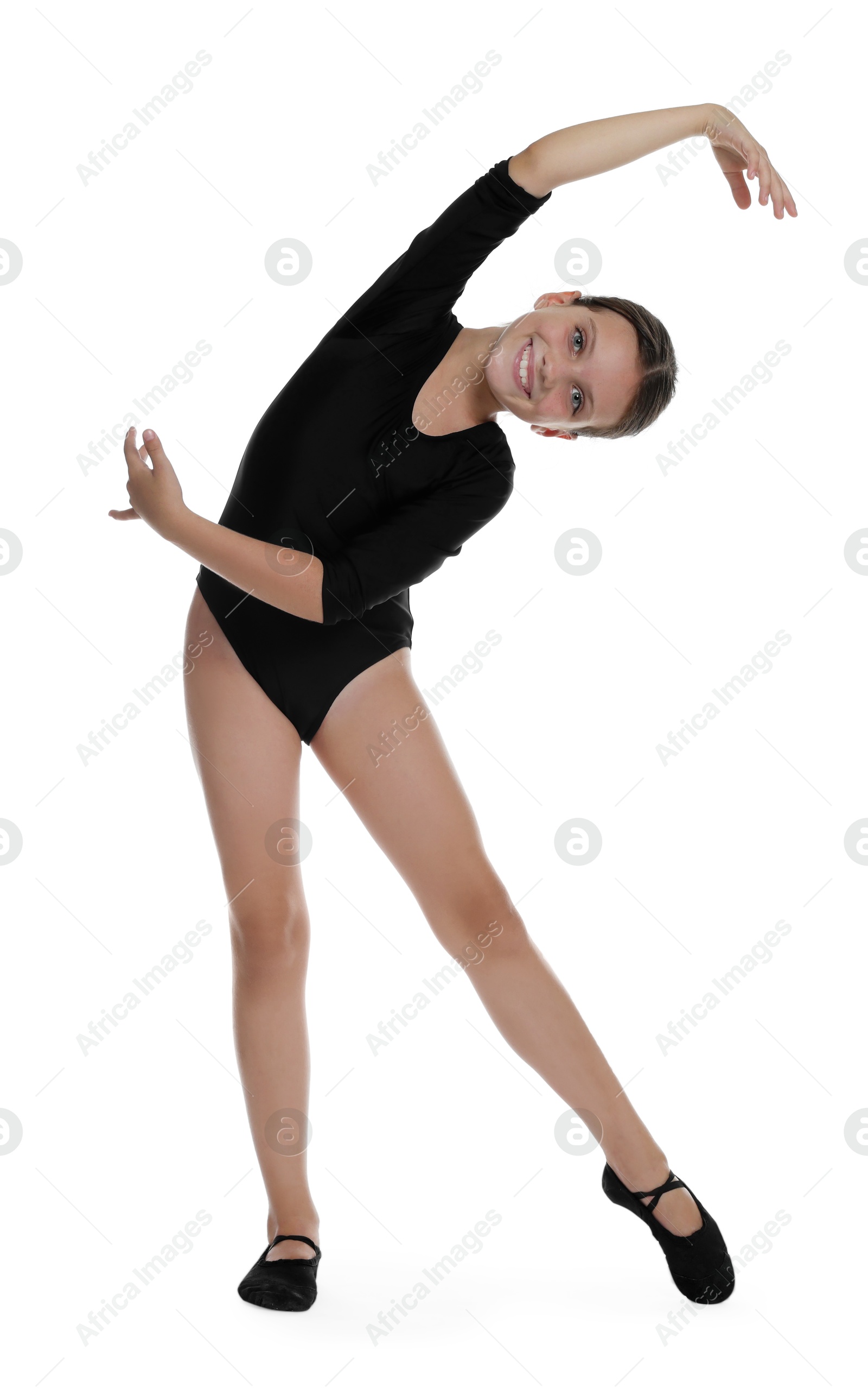 Photo of Little ballerina practicing dance moves on white background