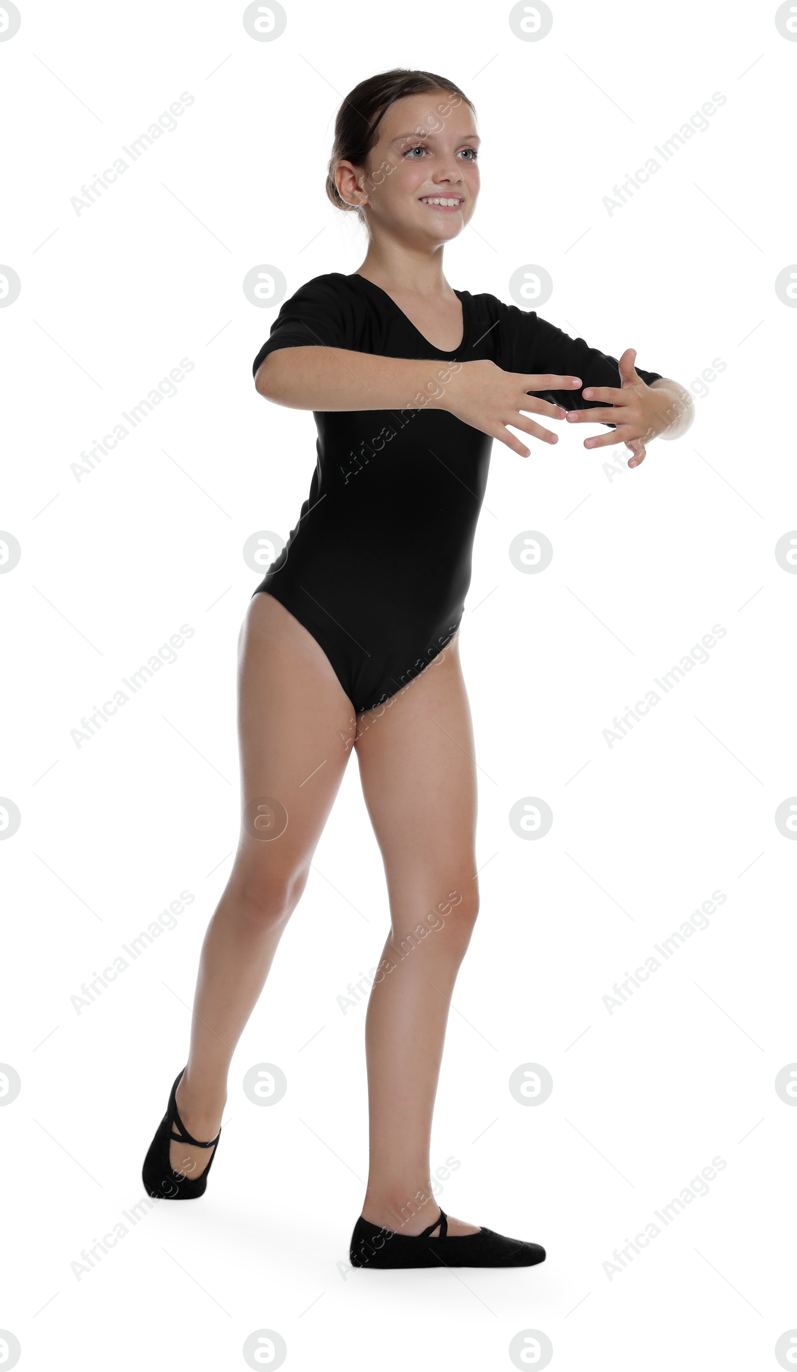 Photo of Little ballerina practicing dance moves on white background